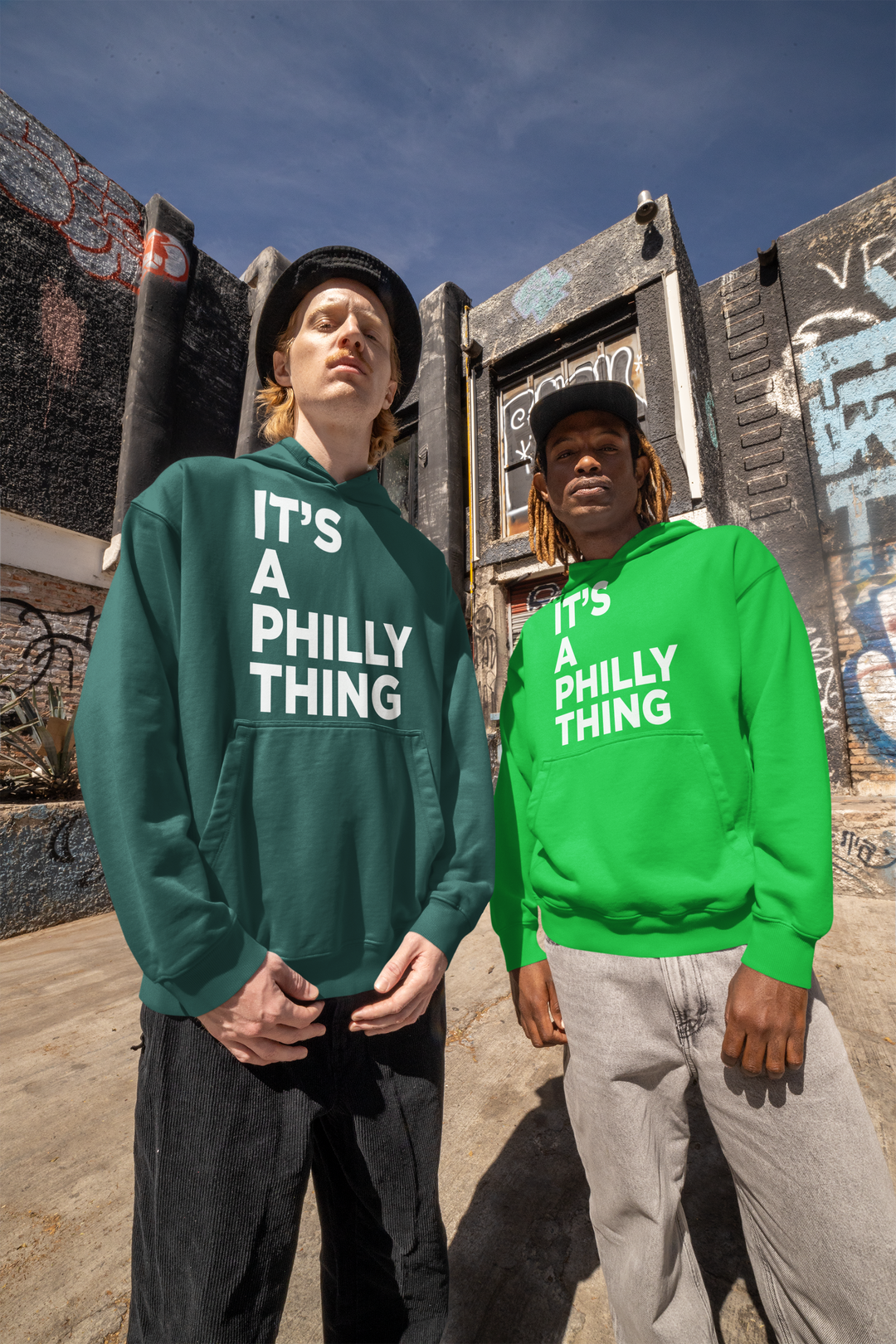 Two people wearing green It's A Philly Thing hoodies outdoors