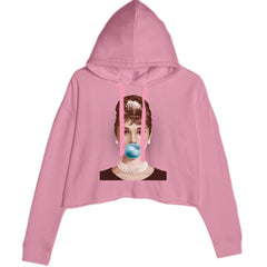 Audrey Hepburn pop-art portrait blowing a bright blue bubble gum on a women's cropped fleece hoodie