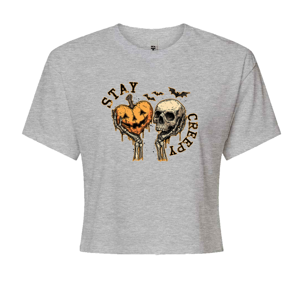 Stay Creepy Skull and Pumpkin Halloween graphic on Women's Boxy Crop T-Shirt in Heather Grey