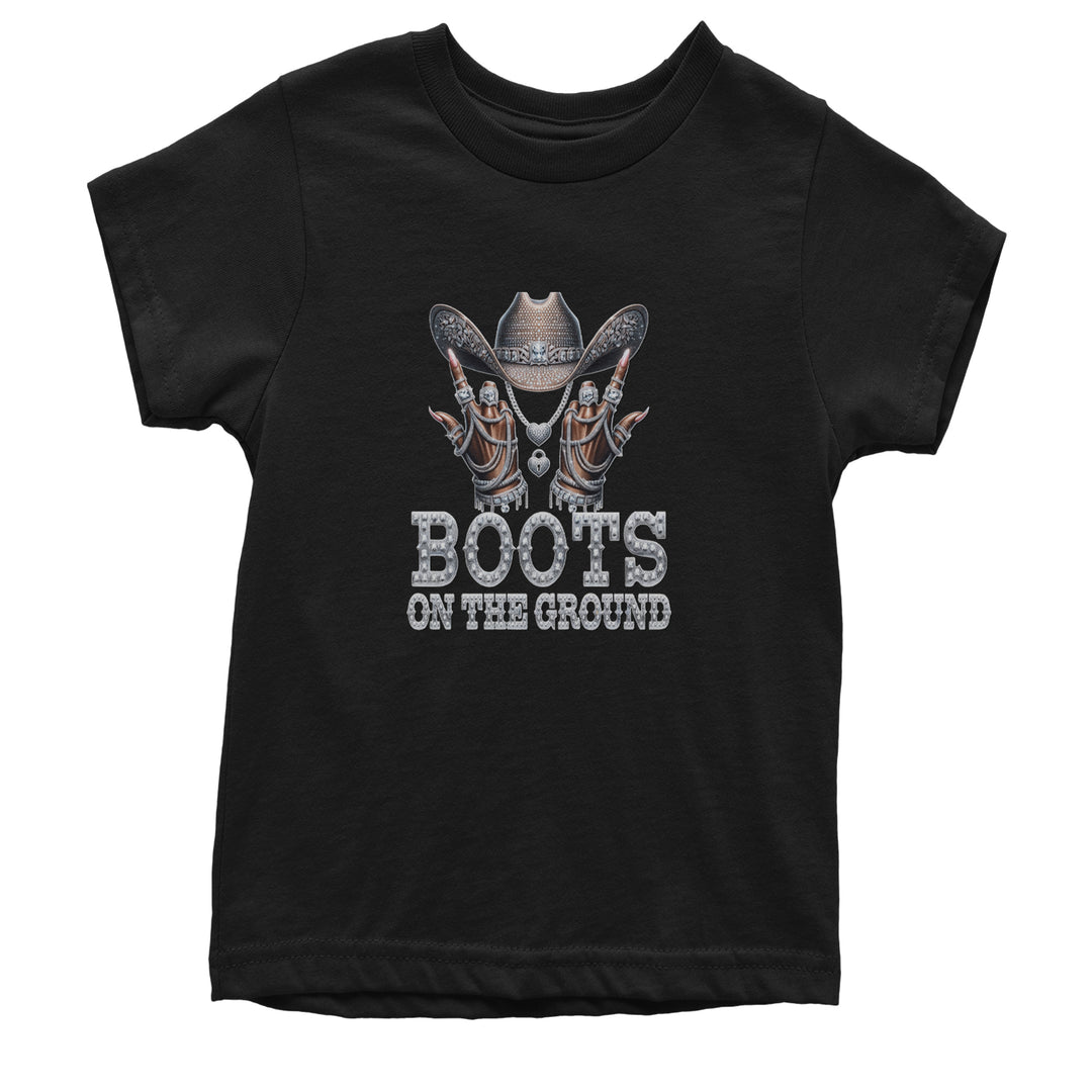 Kids' Heavyweight Cotton T-Shirt with rhinestone-style cowgirl hat, iced-out hands, drippy jewelry details, and bold boots on the ground text