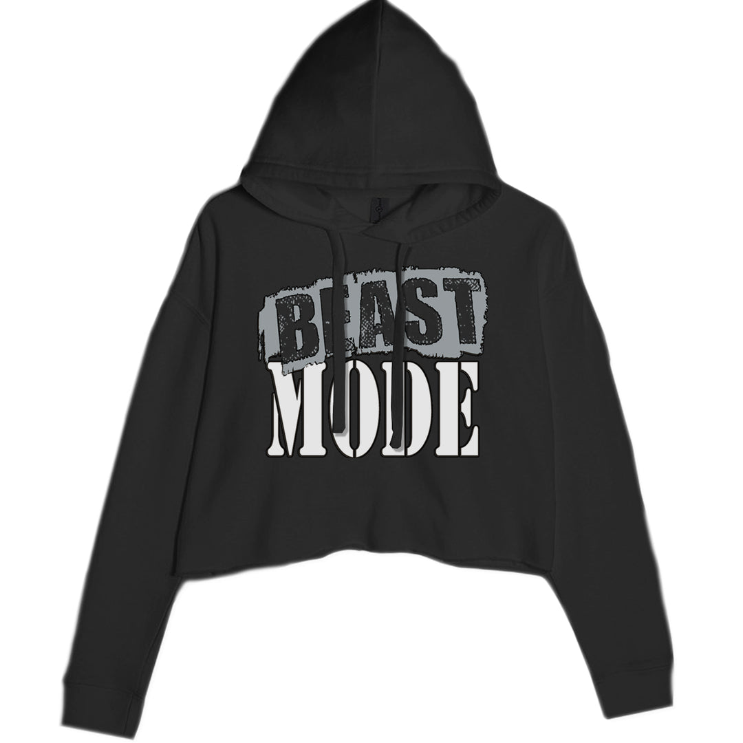 BEAST MODE bold distressed typography on a women's cropped fleece hoodie with drawcord hood and raw-edge hem