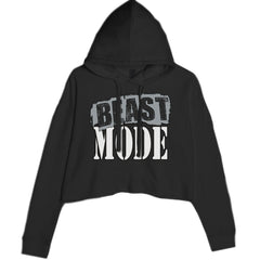 BEAST MODE bold distressed typography on a women's cropped fleece hoodie with drawcord hood and raw-edge hem