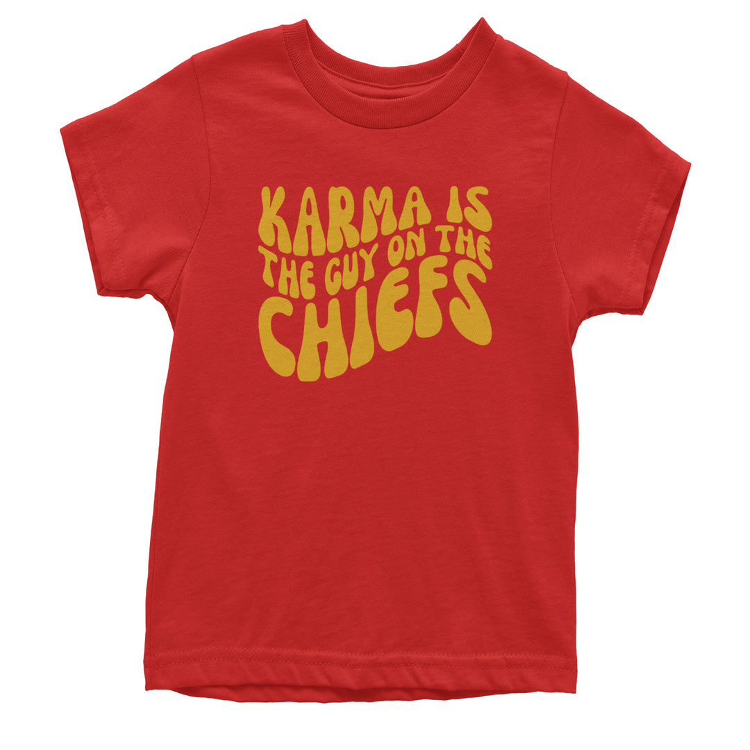 Kids' heavyweight cotton T-shirt with chunky, wavy yellow lettering on a red background reading "KARMA IS THE GUY ON THE CHIEFS"