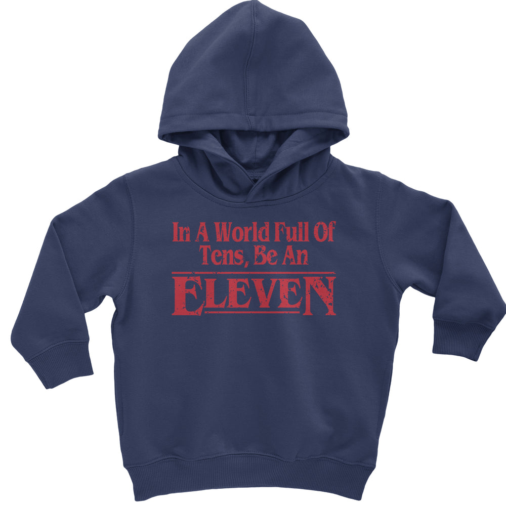 In A World Full Of Tens, Be An Eleven graphic on Toddler Hoodie and Baby Fleece Onesie in Navy Blue