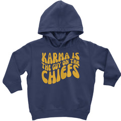 Wavy yellow text on red reading "KARMA IS THE GUY ON THE CHIEFS" on a toddler pullover fleece hoodie and infant footless fleece one-piece