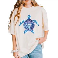 Ocean Aura Tie-Dye Sea Turtle graphic on Garment-Dyed Heavyweight Unisex T-Shirt in Ivory
