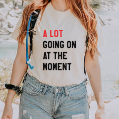 Ivory Comfort Colors 1717 garment-dyed unisex T-shirt with stacked bold text; red top line and black lettering