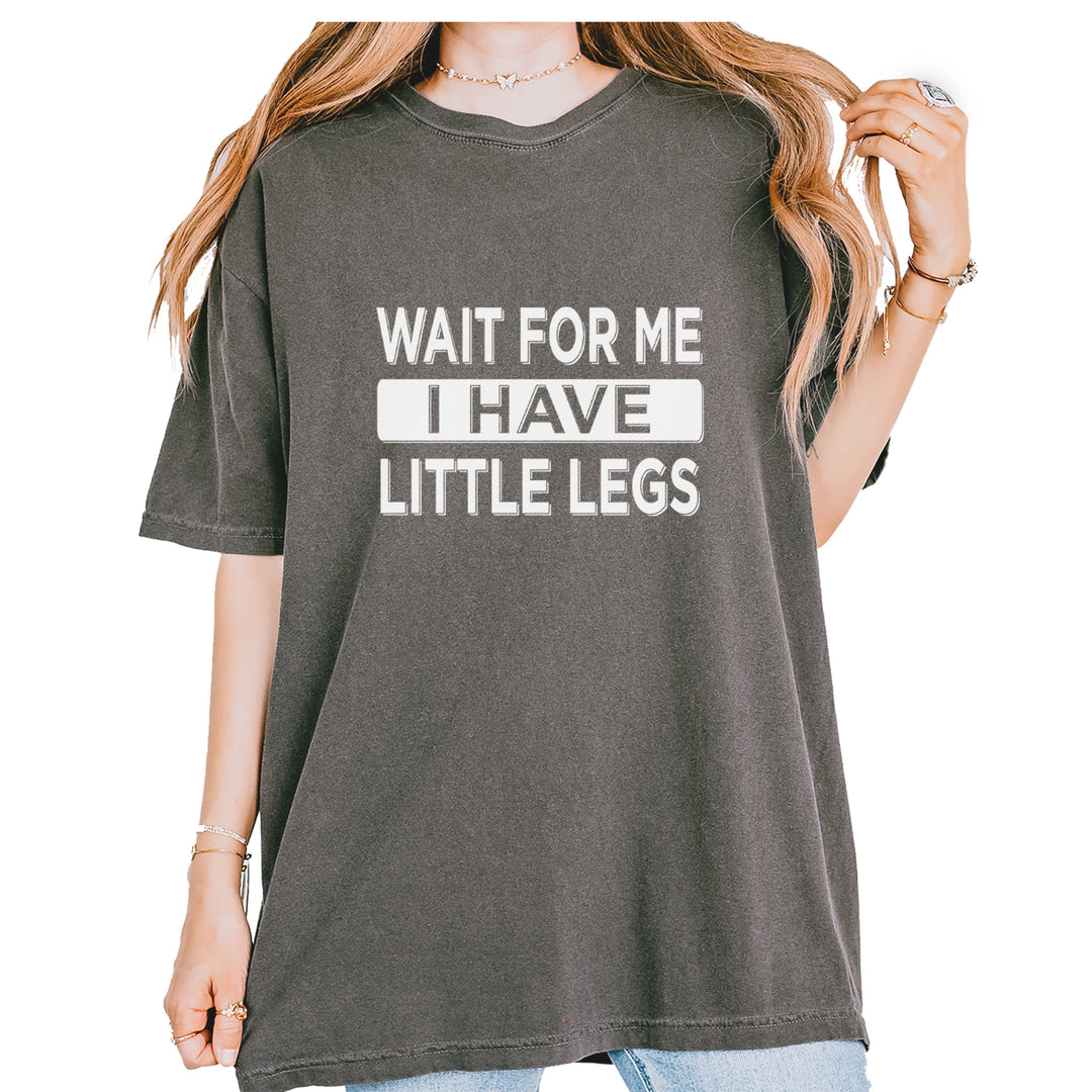 Garment-Dyed Heavyweight Unisex T-Shirt with bold quote text "WAIT FOR ME I HAVE LITTLE LEGS"