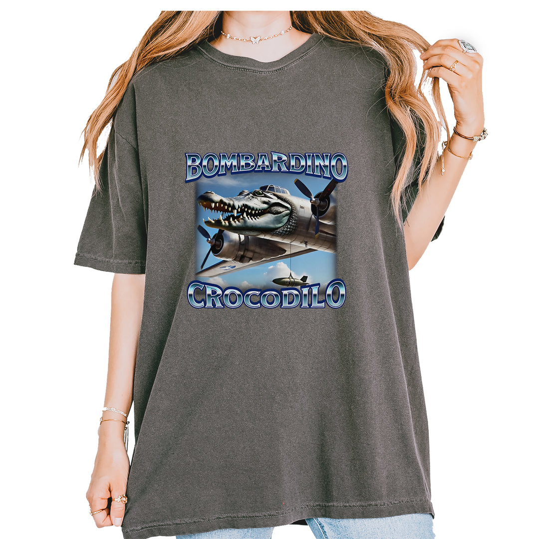 Comfort Colors 1717 garment-dyed unisex T-shirt with a surreal crocodile head fused to a propeller plane and bold Bombardino Crocodilo wording